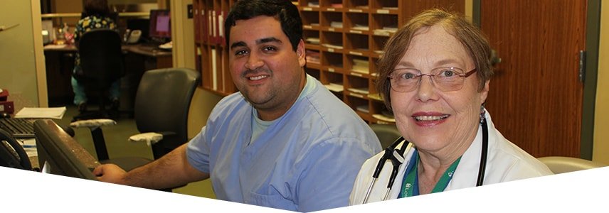 Nurse and doctor sitting together in a room